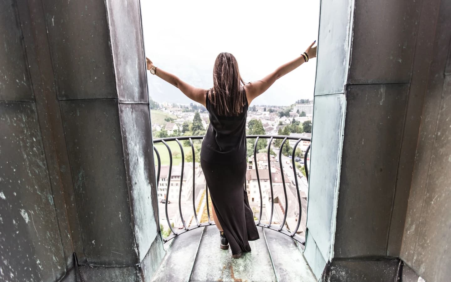 The CC0 portrait before background blur, with the doorway and city scene still visible
